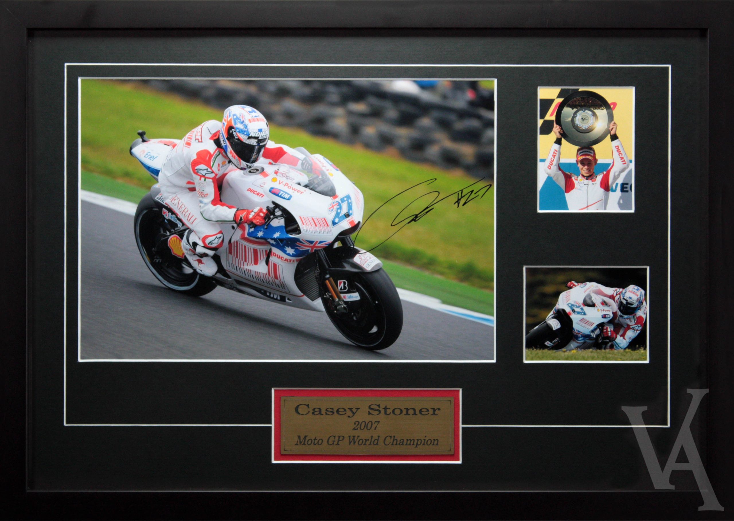 Casey Stoner Signed & Framed Moto GP Racing Memorabilia. Team Ducati White Bike Moto GP World Champion.